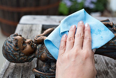 Wooden statue cleaning